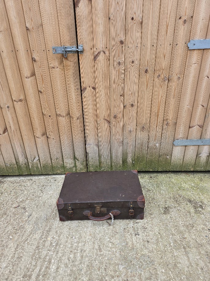 Dark brown small suitcase