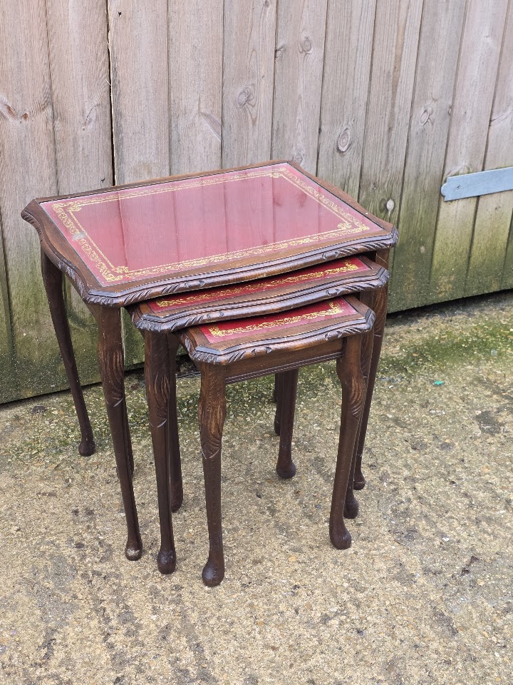 Queen Anne style leather top nest of tables with glass tops